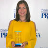 image of Emma McClain receiving PRSSA award.